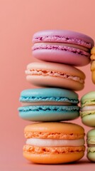 Wall Mural - Stack of colorful macarons on peach background