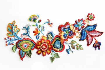 Wall Mural - A group of colorful embroidered flowers sit on a white surface, perfect for illustrations or graphics