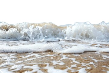 Wall Mural - a close-up shot of a wave breaking on the shore, with sand and water visible