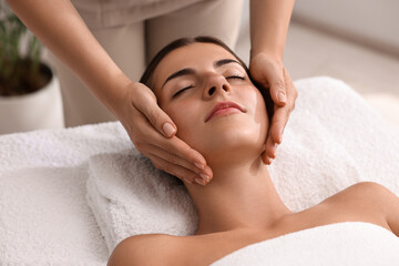 Canvas Print - Attractive woman enjoying face massage, closeup. Beauty procedure