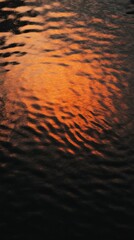 Sticker - Rippling water reflecting orange sunset light