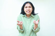 © M Alfan Setyawan - what do you want. angry asian woman wearing green casual clothes shrugging shoulders and raising palms forward show questioning gesture standing over isolated background, looking at camera