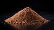 © Maksym - A close-up view of brown powdered substance on a reflective surface against a dark background