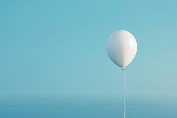 A solitary white balloon floats against a serene blue backdrop, evoking feelings of tranquility and simplicity in a vast space.