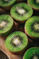 Wall Mural - A close up of a green kiwi fruit with a slice missing. Concept of freshness and natural beauty