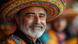 © Dreamy Elen - Elderly Man Wearing a Colorful Traditional Mexican Hat, Smiling at a Harvest Festival, Representing Cultural Pride and Community