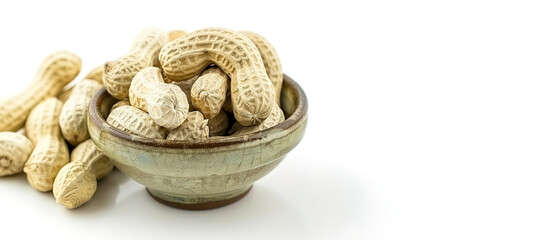 A bowl of peanuts on a white background. The peanuts are in the shell and are a light brown color.