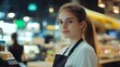 © michaswelt - young and attractive saleswoman, cashier serving customers