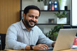 © 为轩 张 - Handsome Indian Man Working on Laptop in Modern Office Setting
