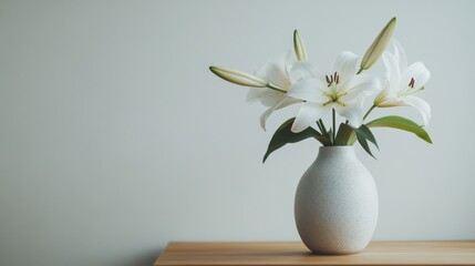 Poster - A close-up of a ceramic vase with a minimalist design, filled with white lilies, placed on a wooden table against a plain white wall, symbolizing elegance and simplicity.