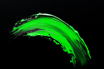Wall Mural - bright green brush stroke of paint on black background