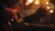 © somneuk - A guitarist tuning their instrument before a performance, focused and ready to play
