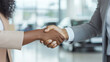 © forenna - Deal Completed: Smiling Black Woman and Salesperson Shaking Hands at a Car Dealership, with a Car Showroom Background and Copy Space. photo