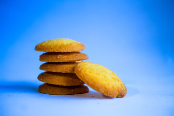 Danish butter cookies, stack of golden chocolate butter cookies isolated on white background, sweet pastry