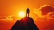 © Ariep - Silhouette of a Man Standing on a Mountain Top at Sunset