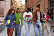 © Gigi Delgado - Internacional group of university students walking at school campus, talking and bonding while entering together to class. Image with copy space.