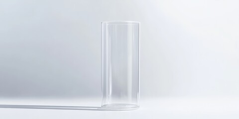 Wall Mural - a clear plastic container with a glossy finish, standing upright with soft shadows on a white surfac