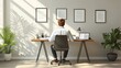 © KN Studio - Man Sitting At Modern Home Office Desk With Laptop, Plant, Documents, And Wall Art