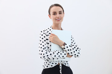 Wall Mural - Portrait of smiling businesswoman with laptop on white background