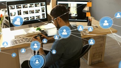 Poster - Animation of network of connections with icons over caucasian businessman using smartphone