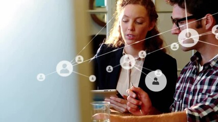 Poster - Animation of network of connections with icons over caucasian business people talking