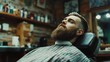© alan - Hipster with beard at barber