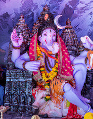 A Closeup shot Ganpati Installed in a Pandal during the 10 Day Ganesh Festival, the idols are immersed in heavy water bodies after the 10 days.