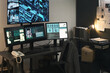 © pressmaster - Monitoring and analyzing security footage in a modern surveillance room with multiple screens and high-tech equipment displayed Organized workspace shows detailed data and information