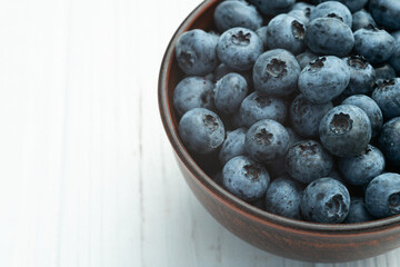 Poster - Blueberry photography in a bowl on rustic background