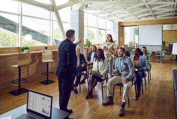 Office meeting where the chief executive leads a business discussion with office workers. Moment captures the essence of communication, leadership, and teamwork as group members discuss strategies.