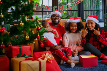 Wall Mural - Family decorate Christmas tree at home.