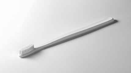 Simple Toothbrush: A plain, white toothbrush with a minimalist design, lying flat on a white background, with a soft shadow beneath it.
