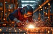 © tongpatong - An expert worker in an industrial setting, using protective gear and a helmet, is welding a metal piece and producing dazzling sparks.
