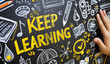 © Sascha - Keep learning written on chalkboard. Concept of knowledge, improvement, development and keeping up the motivation to learn new things in study, school and career.