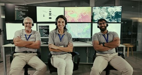 Fototapete - Arms crossed, launch and satellite with team in control room for space exploration, engineering innovation or celebration. Sonar capsule, rocket system or project with people in spacecraft navigation