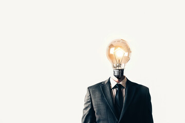 Poster - A man's head is shown with a light bulb in it. Concept of intelligence and creativity, as the light bulb represents an idea or a thought. The man's suit and tie also add to the professional