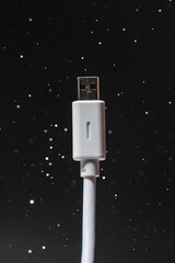 Aufkleber - A close-up shot of a white USB cable