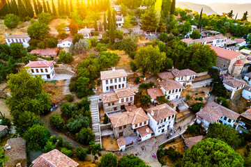 Sirince is a neighbourhood in Selcuk, Izmir Province, Turkey. Aerial drone view of ancient village Sirince. Beautiful landscape of Sirince with traditional historical houses.