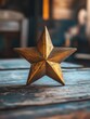 © MK - Gold Star on Wooden Table