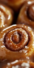 Wall Mural - Delicious homemade cinnamon rolls glistening with icing and sugar