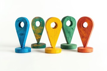Poster - A collection of bright colored wooden markers on a white background, ideal for educational and creative uses