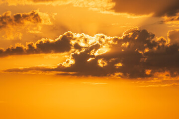 Wall Mural - Natural yellow cloudy sunset background