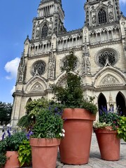 view of the facade of the holy cross cathedral of orleans on a sunny summer day
