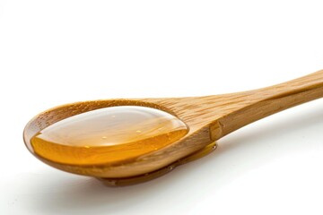 Aufkleber - A wooden spoon filled with liquid sitting on a white surface