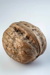 Poster - A single walnut shell sitting on a white background
