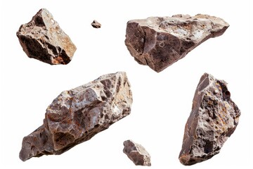Poster - A group of rocks sitting on top of a white surface, ideal for use as a decorative element or to represent natural formations