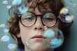 © Tanu - A young boy with curly hair and glasses observes colorful bubbles drifting through the air, showcasing a moment of curiosity and fascination during a playful day.