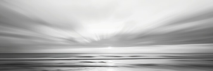 Canvas Print - Blurry view of a sunset in muted gray hues amidst clouds