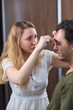 © Евгений Вершинин - A man with makeup being applied, showing a closeup of the process focusing on his eyebrows