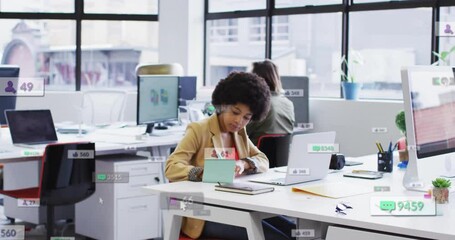 Poster - Animation of icons and numbers over african american businesswoman in office